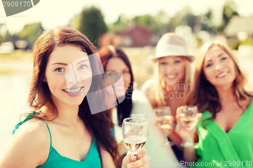 Image of smiling girls with champagne glasses