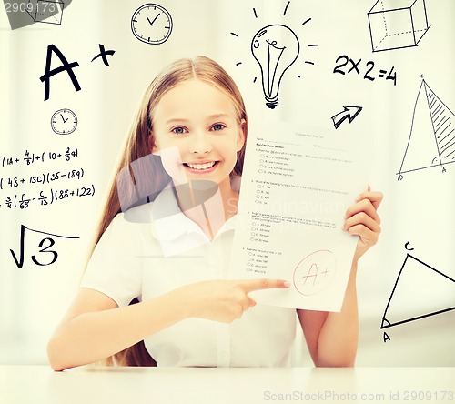 Image of girl with test and A grade at school