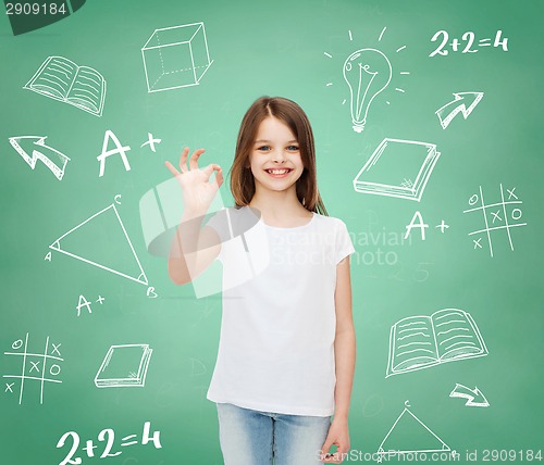 Image of smiling little girl in white blank t-shirt