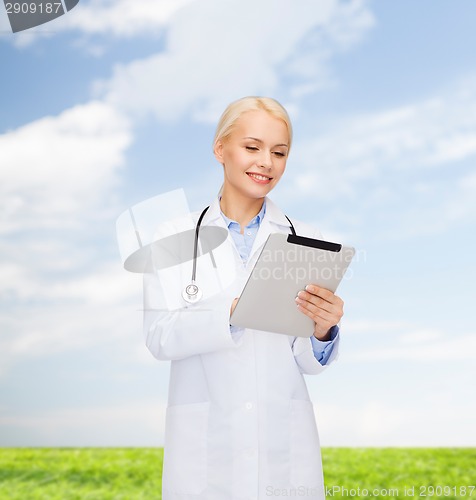 Image of female doctor with stethoscope and tablet pc