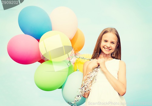 Image of happy girl with colorful balloons