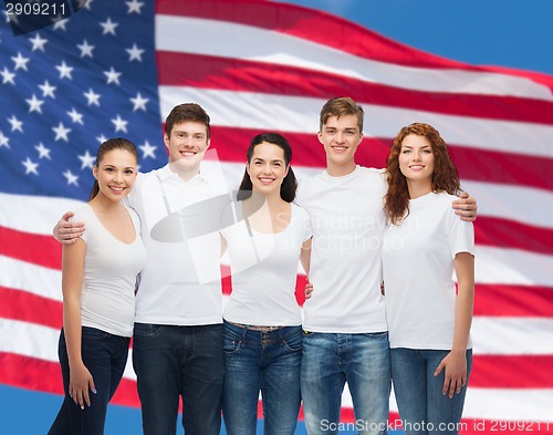 Image of group of smiling teenagers in white blank t-shirts