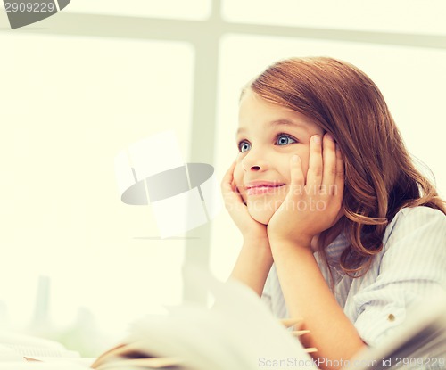 Image of student girl writing in notebook at school