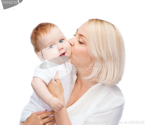 Image of happy mother kissing smiling baby