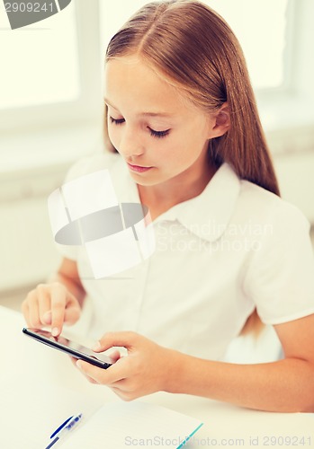 Image of girl with smartphone at school
