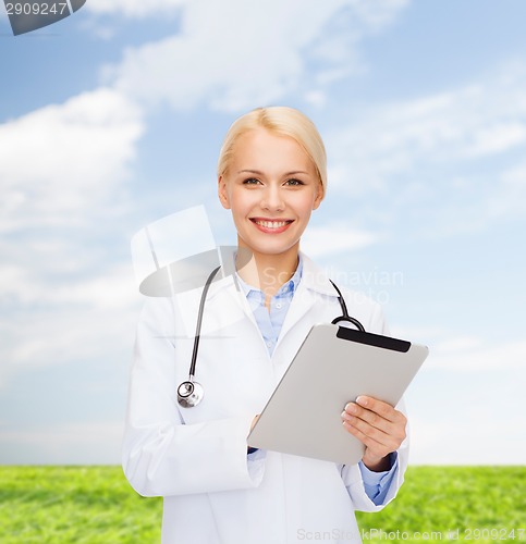 Image of female doctor with stethoscope and tablet pc