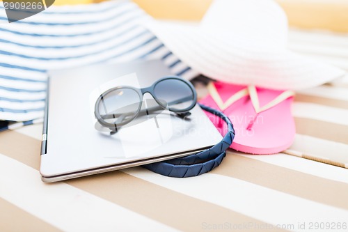 Image of close up of laptop on beach