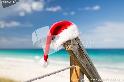 Image of close up of santa helper hat on beach