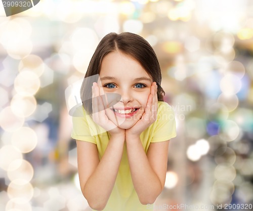 Image of smiling little girl over white background