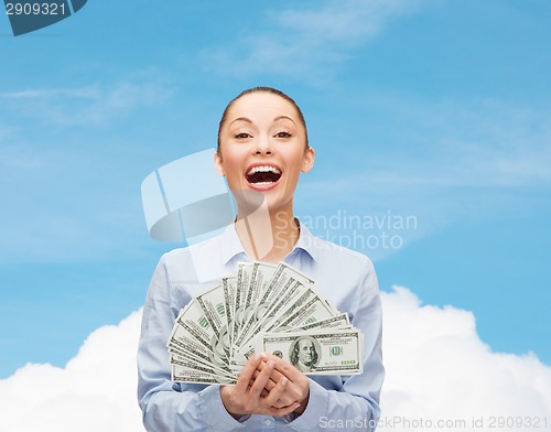 Image of laughing businesswoman with dollar cash money