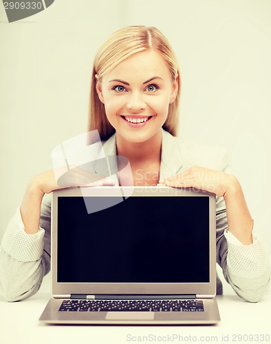 Image of smiling woman with laptop pc