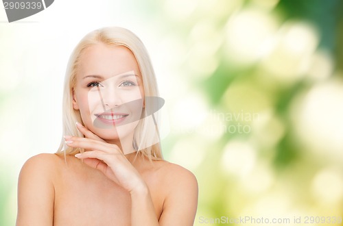 Image of face and hands of beautiful woman