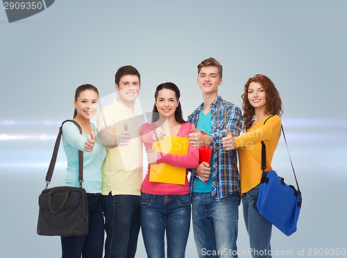 Image of group of smiling teenagers showing thumbs up