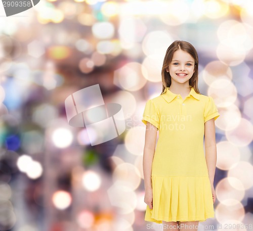 Image of smiling little girl in yellow dress