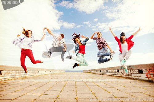 Image of group of teenagers jumping