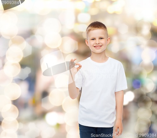 Image of smiling little boy in white blank t-shirt