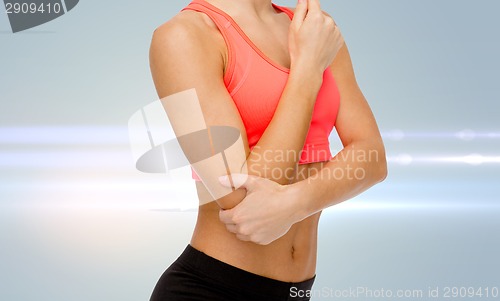 Image of sporty woman with pain in elbow