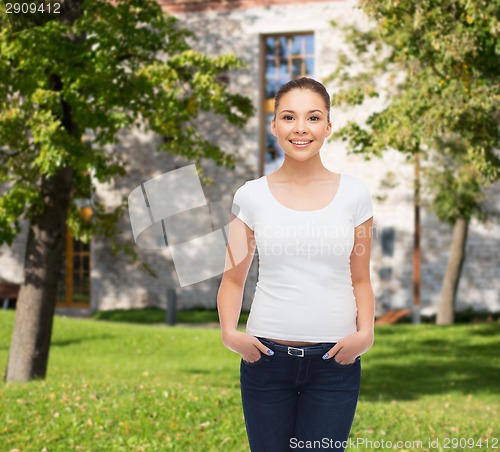 Image of smiling young woman in blank white t-shirt