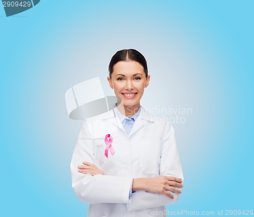 Image of smiling female doctor with cancer awareness ribbon