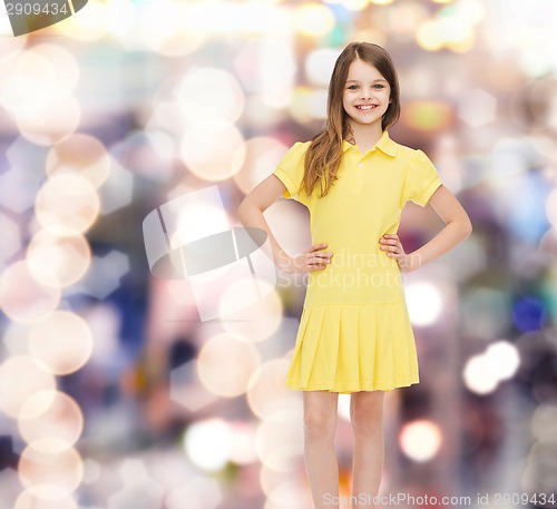 Image of smiling little girl in yellow dress