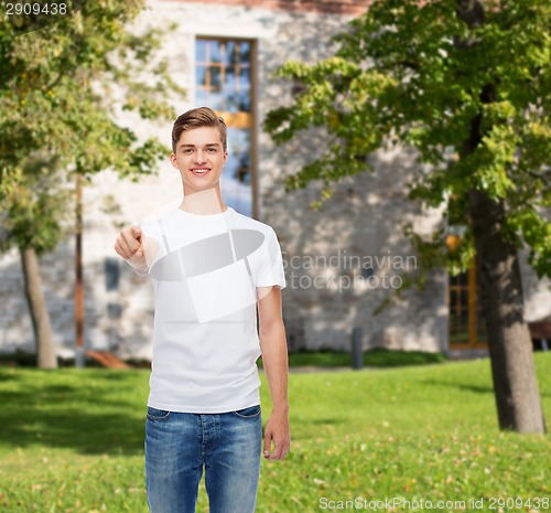 Image of smiling young man in blank white t-shirt