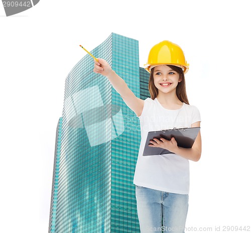 Image of smiling little girl in hardhat with clipboard