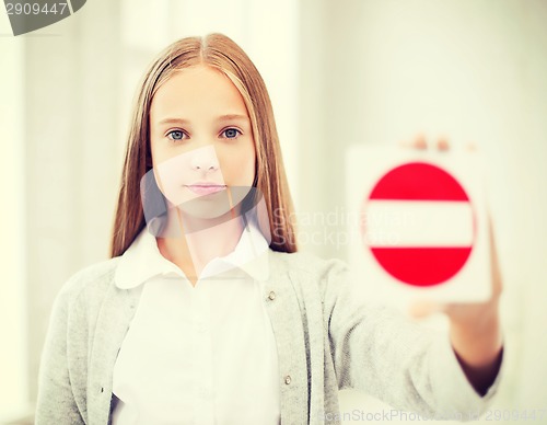 Image of girl showing no entry sign