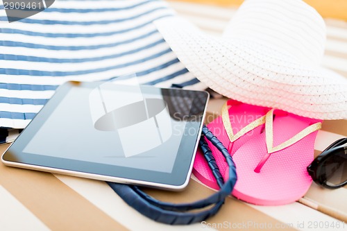 Image of close up of tablet pc on beach