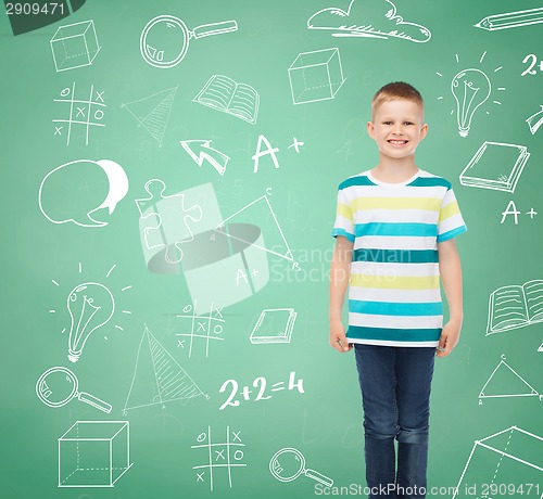 Image of little boy in casual clothes with arms crossed