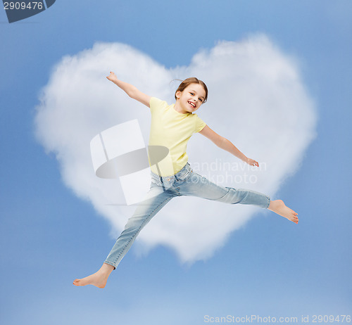 Image of smiling little girl jumping