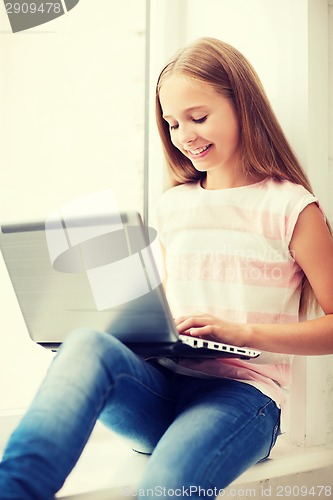 Image of girl with laptop pc at school
