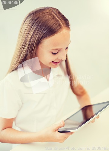 Image of smiling girl with tablet pc at school