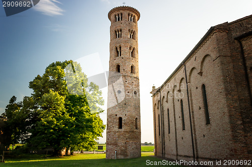 Image of Romanesque cylindrical bell tower of countryside church