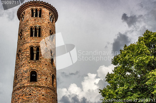 Image of Romanesque cylindrical bell tower of countryside church