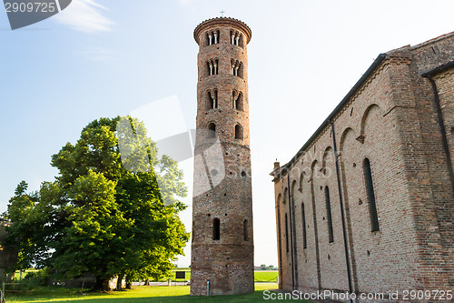 Image of Romanesque cylindrical bell tower of countryside church