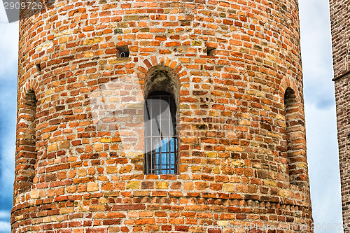 Image of Romanesque cylindrical bell tower of countryside church