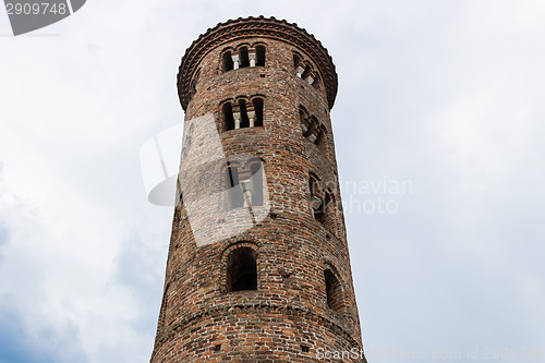 Image of Romanesque cylindrical bell tower of countryside church