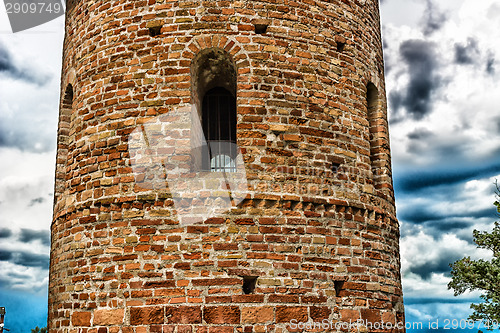 Image of Romanesque cylindrical bell tower of countryside church