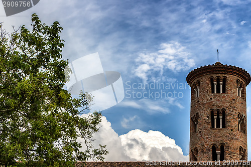 Image of Romanesque cylindrical bell tower of countryside church