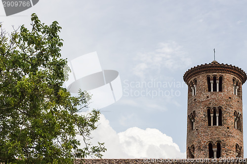 Image of Romanesque cylindrical bell tower of countryside church