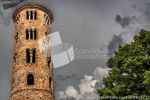 Image of Romanesque cylindrical bell tower of countryside church