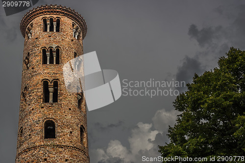 Image of Romanesque cylindrical bell tower of countryside church