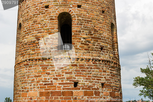 Image of Romanesque cylindrical bell tower of countryside church