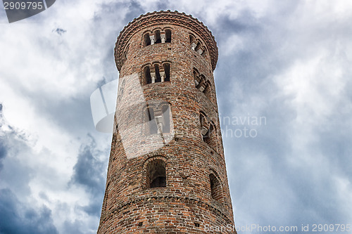 Image of Romanesque cylindrical bell tower of countryside church