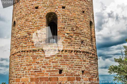 Image of Romanesque cylindrical bell tower of countryside church