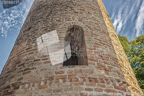 Image of Romanesque cylindrical bell tower of countryside church