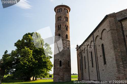 Image of Romanesque cylindrical bell tower of countryside church