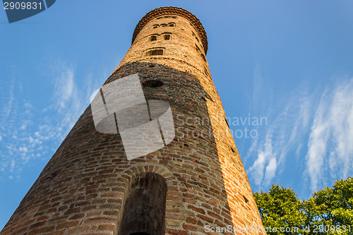 Image of Romanesque cylindrical bell tower of countryside church