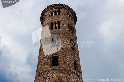 Image of Romanesque cylindrical bell tower of countryside church