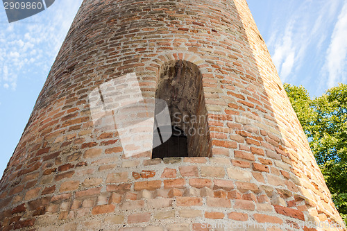 Image of Romanesque cylindrical bell tower of countryside church